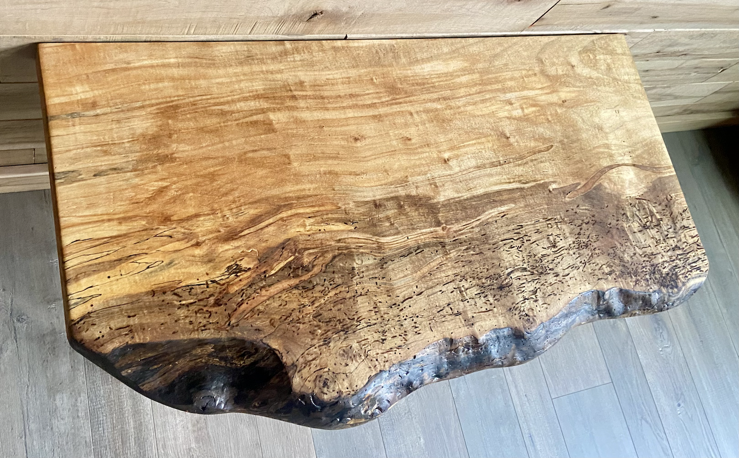 Handmade spalted hardwood vanity top with smooth finish and organic live edge front. Solid wood bathroom vanity top featuring spalted grain, knot detail, and natural character.