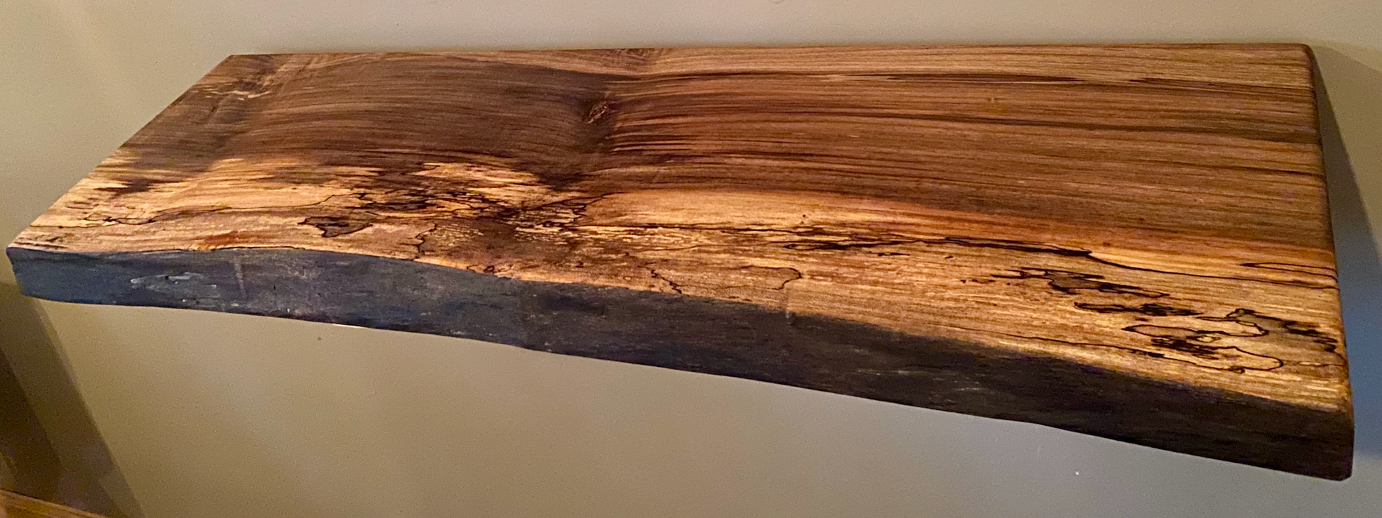 Custom live edge maple shelves with natural wood grain, handcrafted from solid maple. Ideal for rustic, modern, or farmhouse interiors.