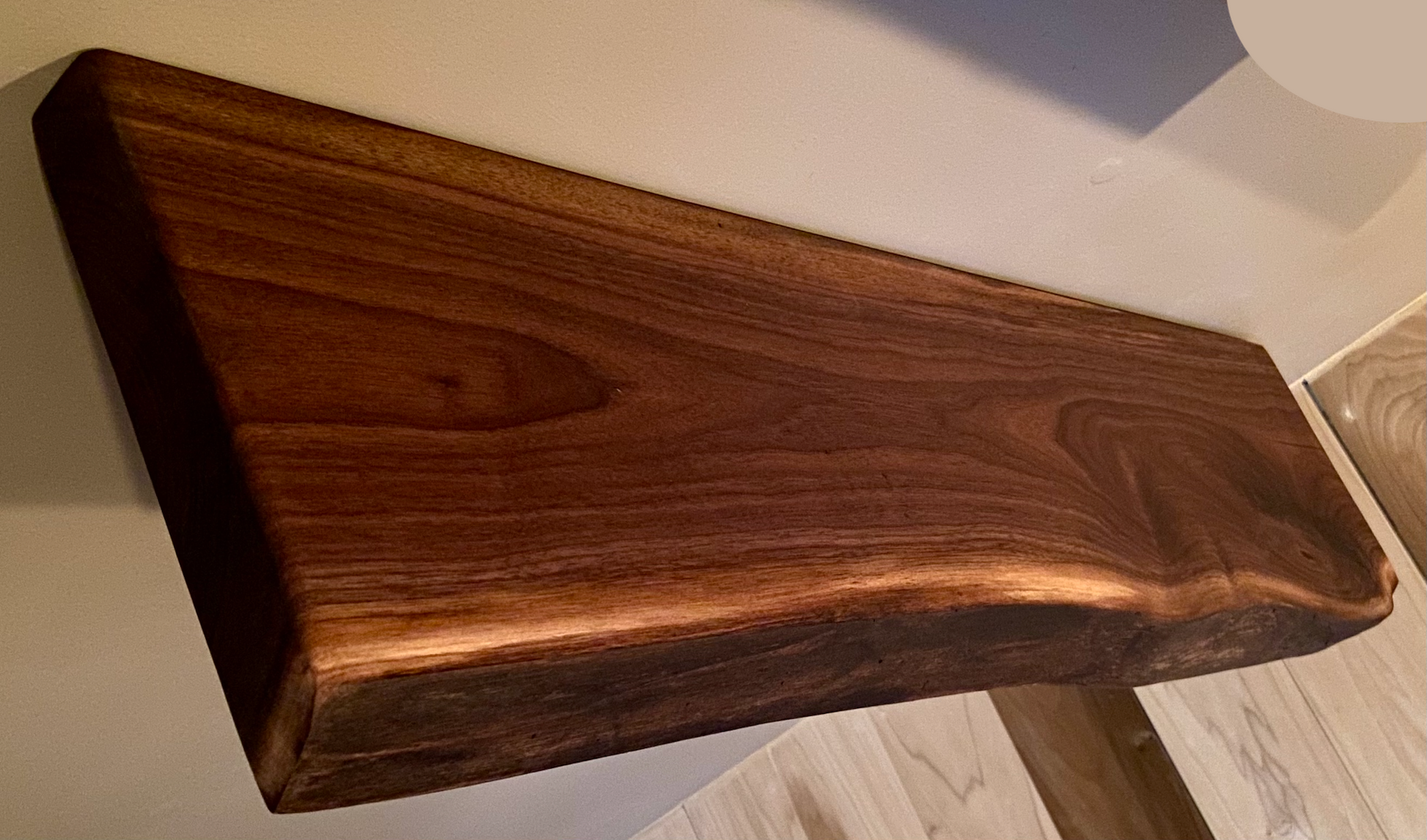 Custom live edge walnut shelves with natural wood grain, handcrafted from solid maple. Ideal for rustic, modern, or farmhouse interiors.