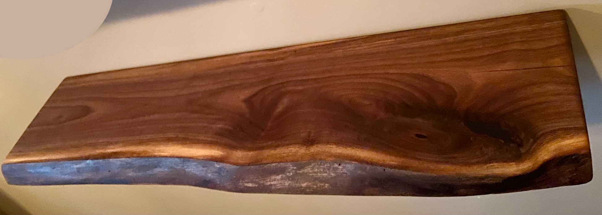 Custom live edge walnut shelves with natural wood grain, handcrafted from solid maple. Ideal for rustic, modern, or farmhouse interiors.