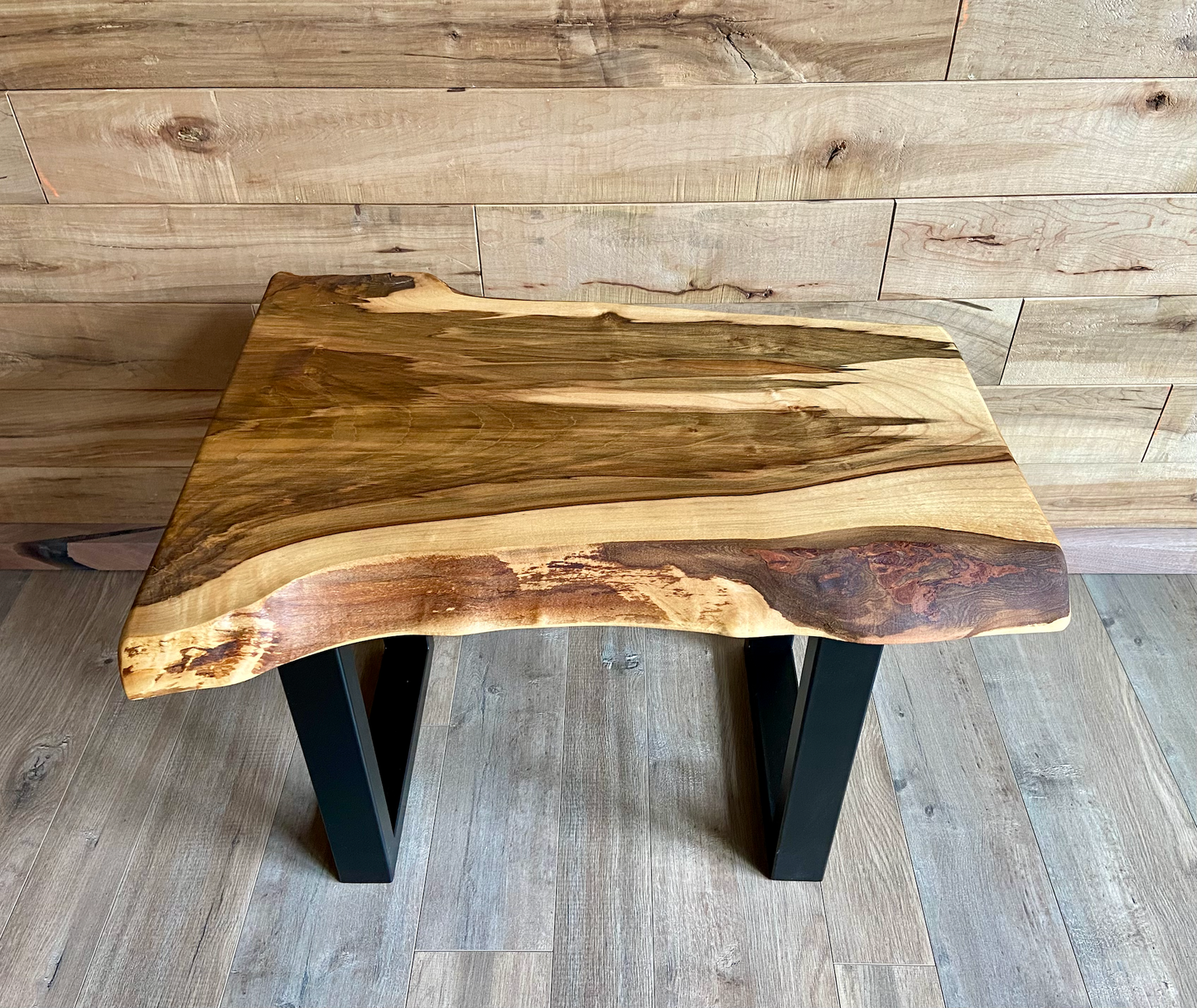 Detailed view of ambrosia maple wood grain, showing natural spalting, color variations, and organic patterns. live edge coffee table made from ambrosia maple, featuring unique grain patterns and a smooth, polished surface. Rustic and modern design. Handcrafted ambrosia maple coffee table styled in a modern living room with a cozy, rustic aesthetic. Top-down view of ambrosia maple coffee table, highlighting natural wood grain, warm tones, and live edge details.