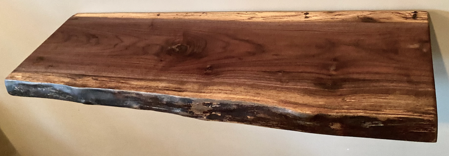 Custom live edge walnut shelves with natural wood grain, handcrafted from solid maple. Ideal for rustic, modern, or farmhouse interiors.