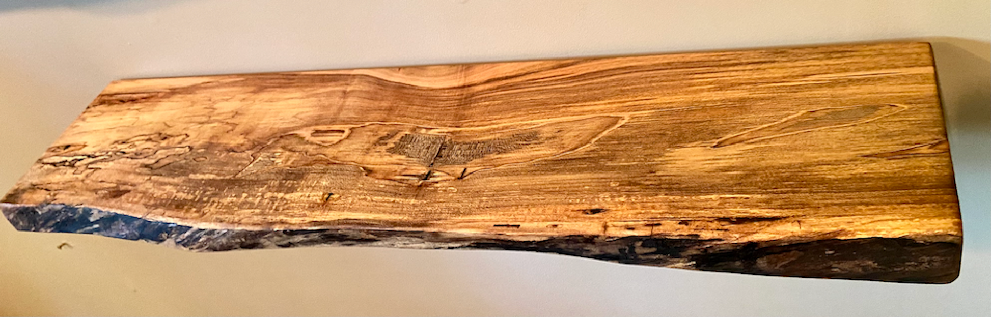 Custom live edge maple shelves with natural wood grain, handcrafted from solid maple. Ideal for rustic, modern, or farmhouse interiors.