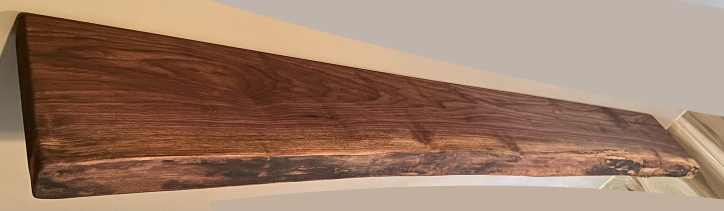 Custom live edge walnut shelves with natural wood grain, handcrafted from solid maple. Ideal for rustic, modern, or farmhouse interiors.