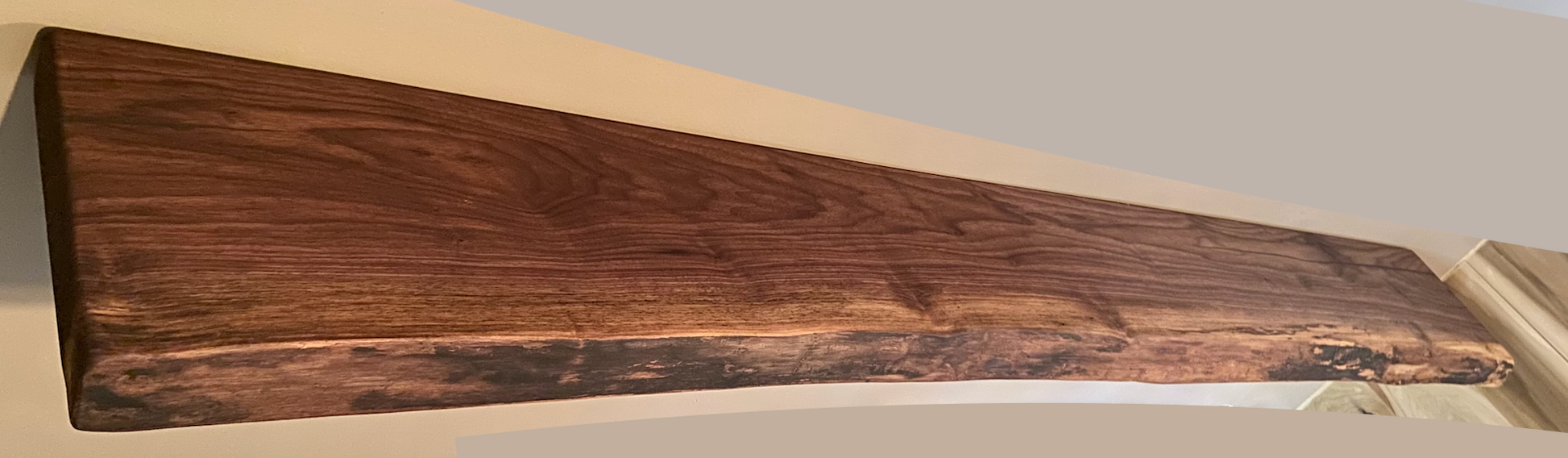 Custom live edge walnut shelves with natural wood grain, handcrafted from solid maple. Ideal for rustic, modern, or farmhouse interiors.