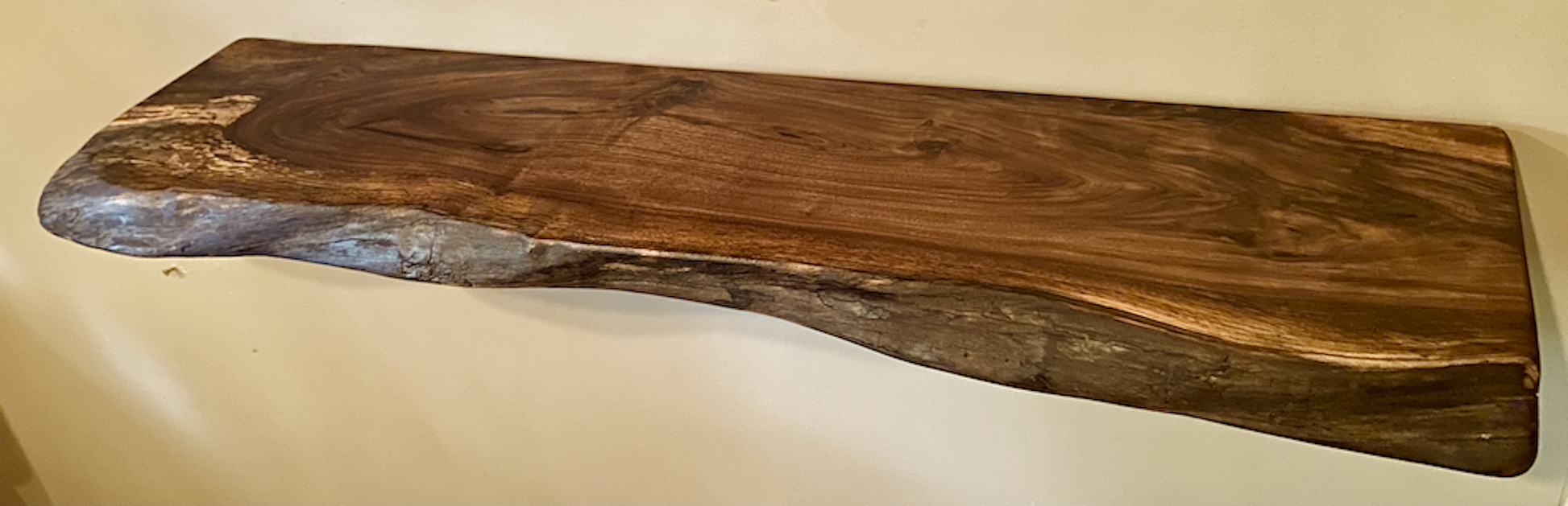 Custom live edge walnut shelves with natural wood grain, handcrafted from solid maple. Ideal for rustic, modern, or farmhouse interiors.