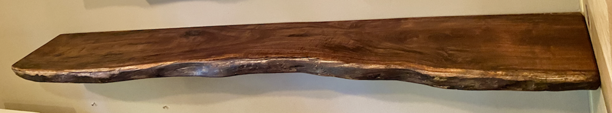 Custom live edge walnut shelves with natural wood grain, handcrafted from solid maple. Ideal for rustic, modern, or farmhouse interiors.