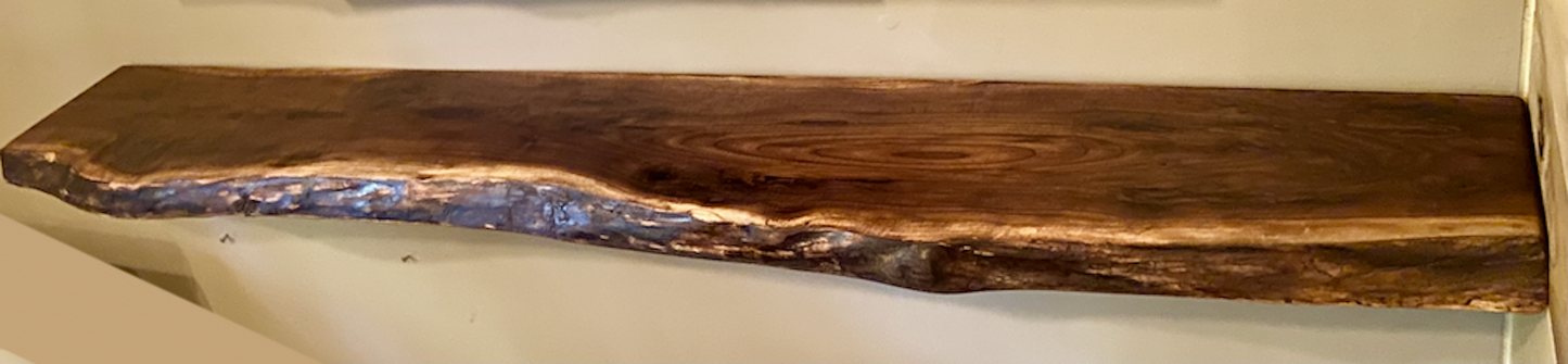 Custom live edge walnut shelves with natural wood grain, handcrafted from solid maple. Ideal for rustic, modern, or farmhouse interiors.