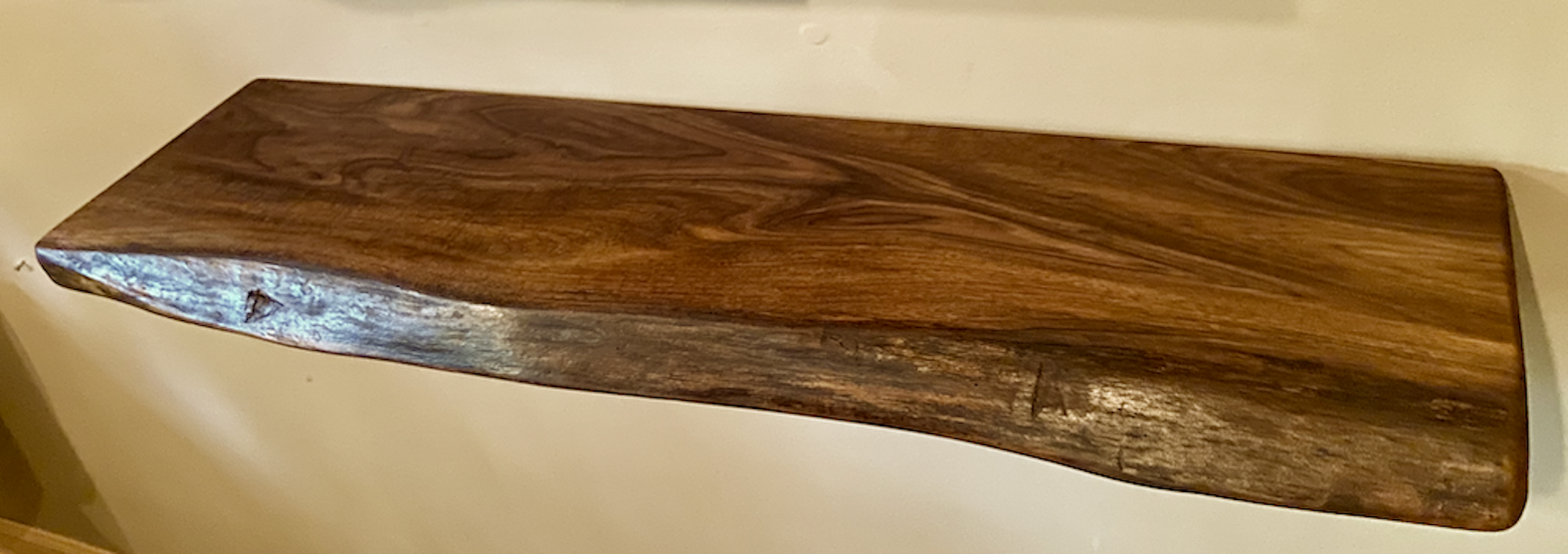 Custom live edge walnut shelves with natural wood grain, handcrafted from solid maple. Ideal for rustic, modern, or farmhouse interiors.