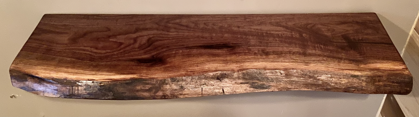 Custom live edge walnut shelves with natural wood grain, handcrafted from solid maple. Ideal for rustic, modern, or farmhouse interiors.