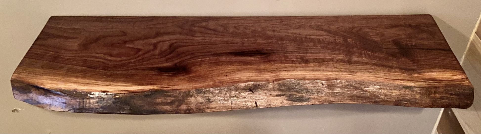 Custom live edge walnut shelves with natural wood grain, handcrafted from solid maple. Ideal for rustic, modern, or farmhouse interiors.