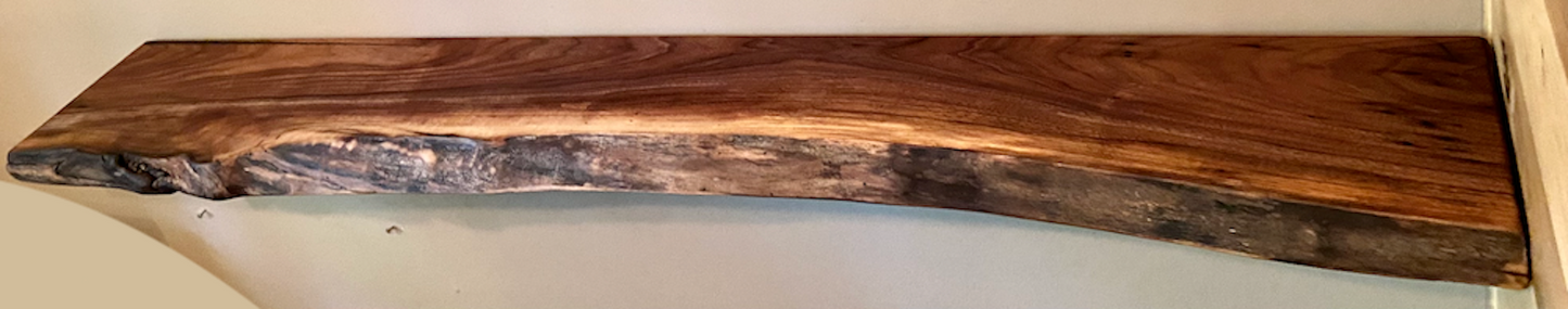 Custom live edge walnut shelves with natural wood grain, handcrafted from solid maple. Ideal for rustic, modern, or farmhouse interiors.