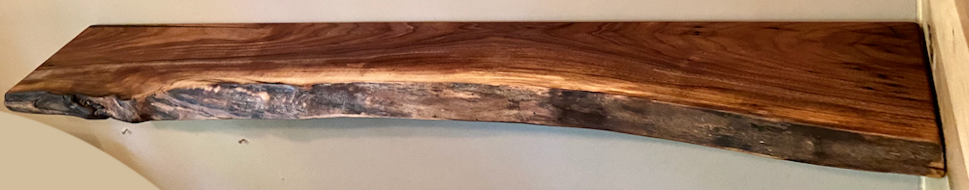 Custom live edge walnut shelves with natural wood grain, handcrafted from solid maple. Ideal for rustic, modern, or farmhouse interiors.