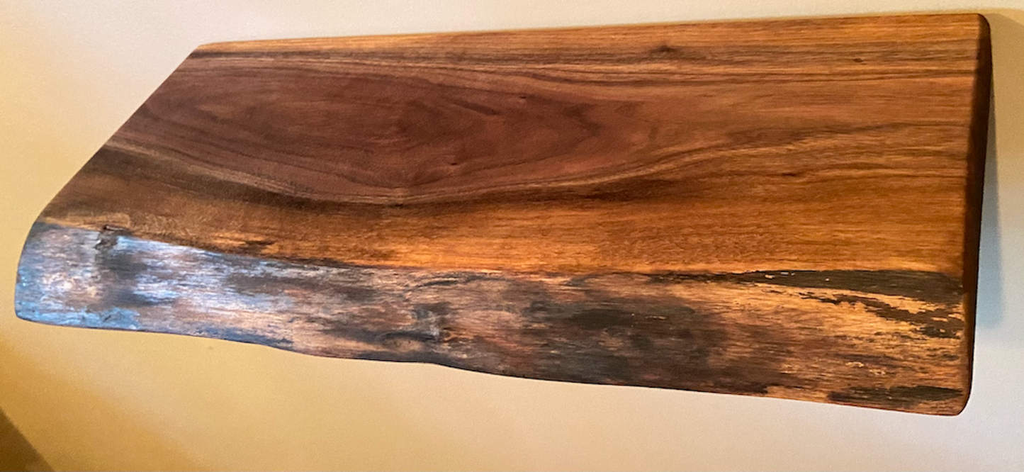 Custom live edge walnut shelves with natural wood grain, handcrafted from solid maple. Ideal for rustic, modern, or farmhouse interiors.