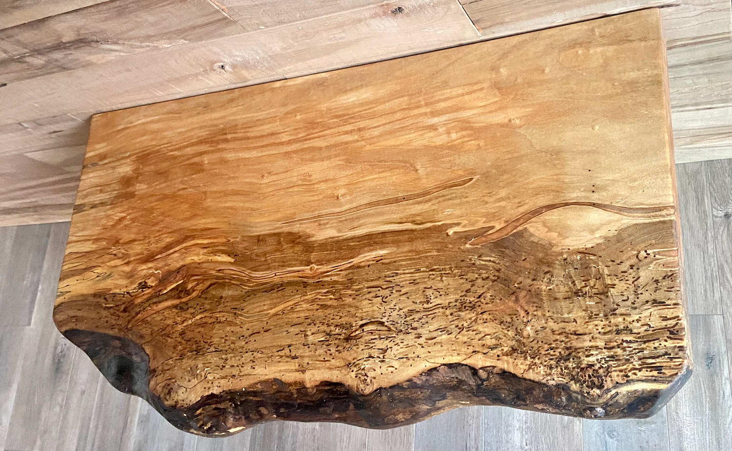 Handmade spalted hardwood vanity top with smooth finish and organic live edge front. Solid wood bathroom vanity top featuring spalted grain, knot detail, and natural character.