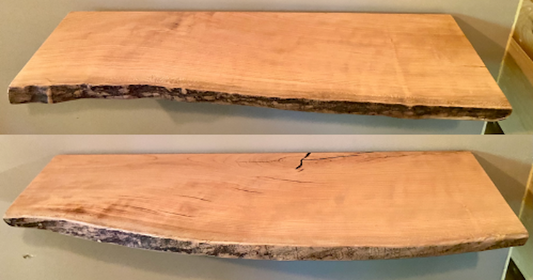 Live edge sycamore wood floating shelf mounted on a wall, showcasing natural grain and rustic edge detail. Two shelves