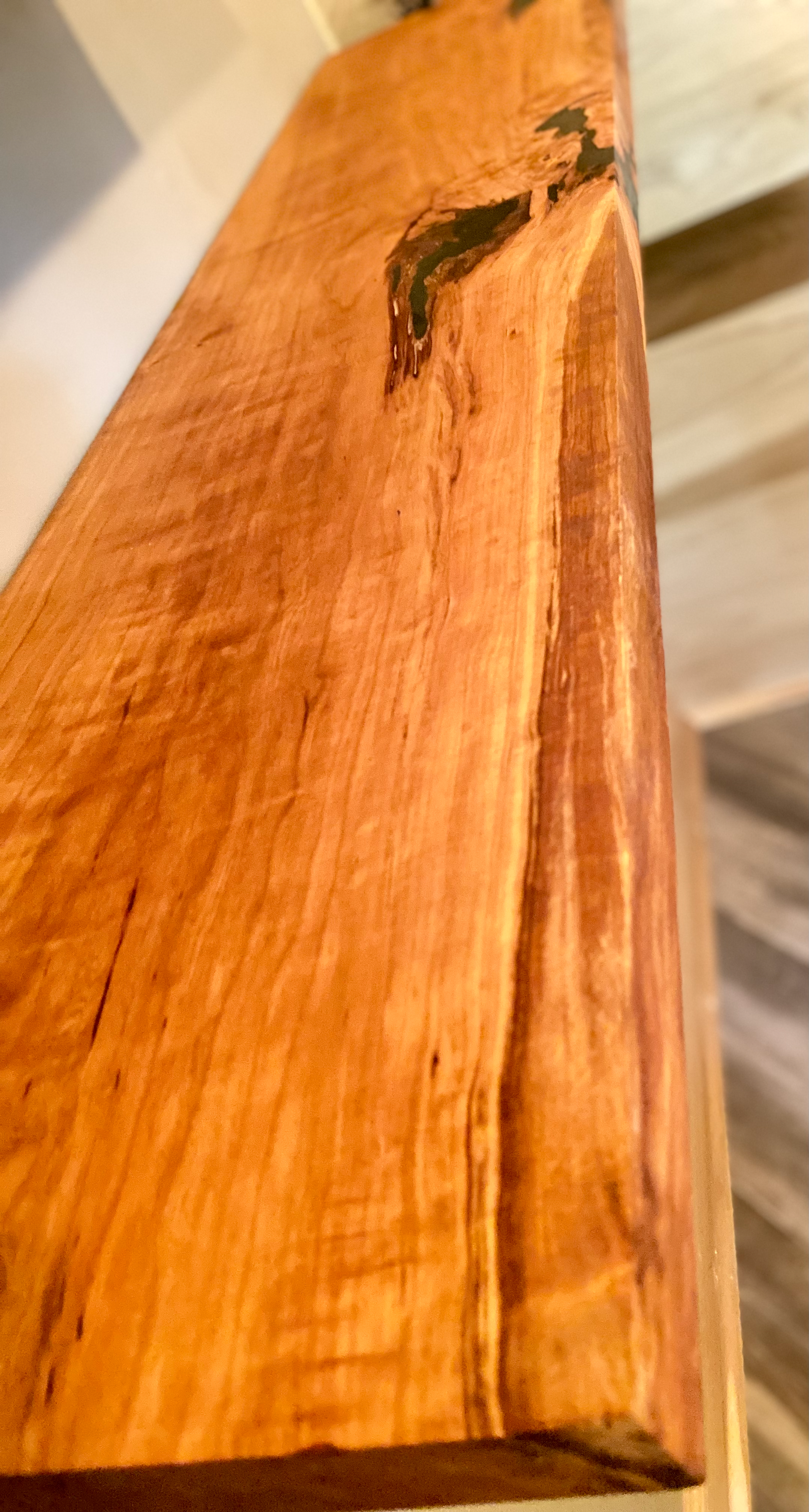 Front view of a handcrafted cherry floating shelf mounted on a wall. Close-up of the solid cherry wood grain, highlighting the shelf’s smooth finish. Side angle showcasing the shelf’s thickness and sturdy wall brackets.